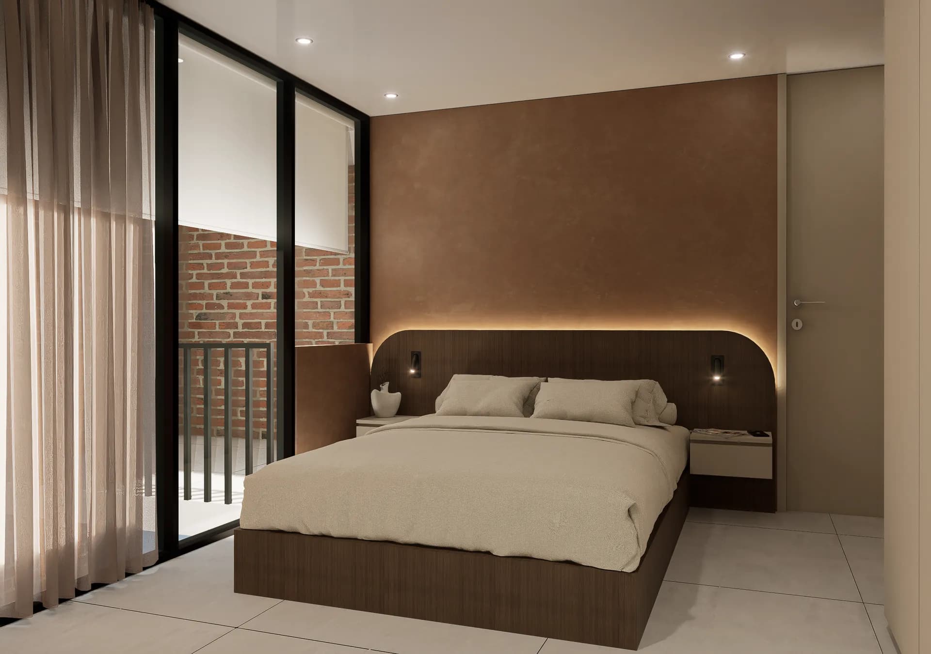 Dormitorio de una suite con cabecero curvo iluminado, lino claro y muro terracota.